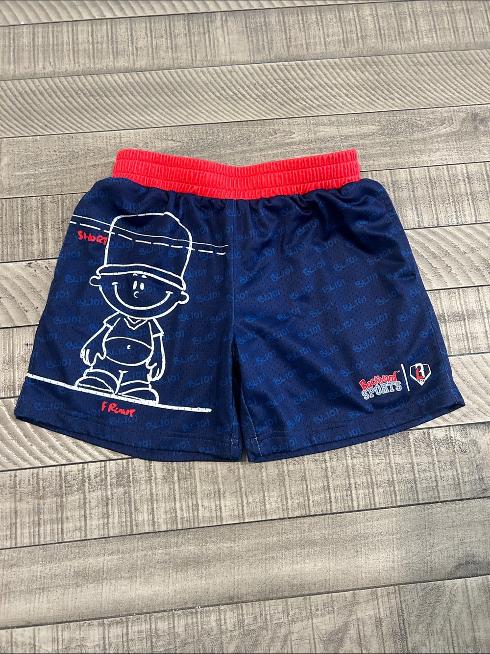 Kids Navy Athletic Shorts with Red Waistband and Cartoon Graphic